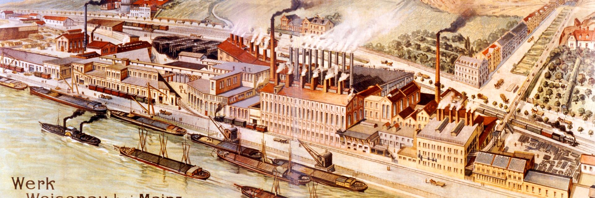 Factory building with smoking chimneys on a river