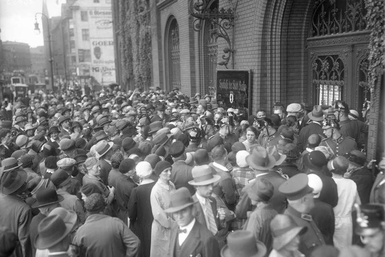 Crowds in front of a bank