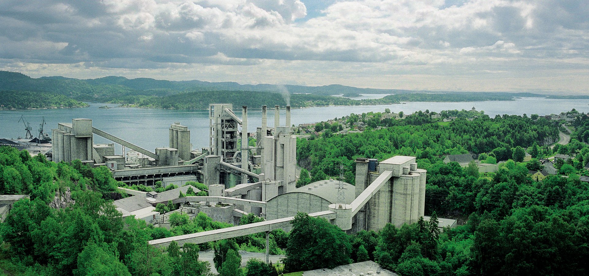 A cement plant surrounded by woodlands and lakes