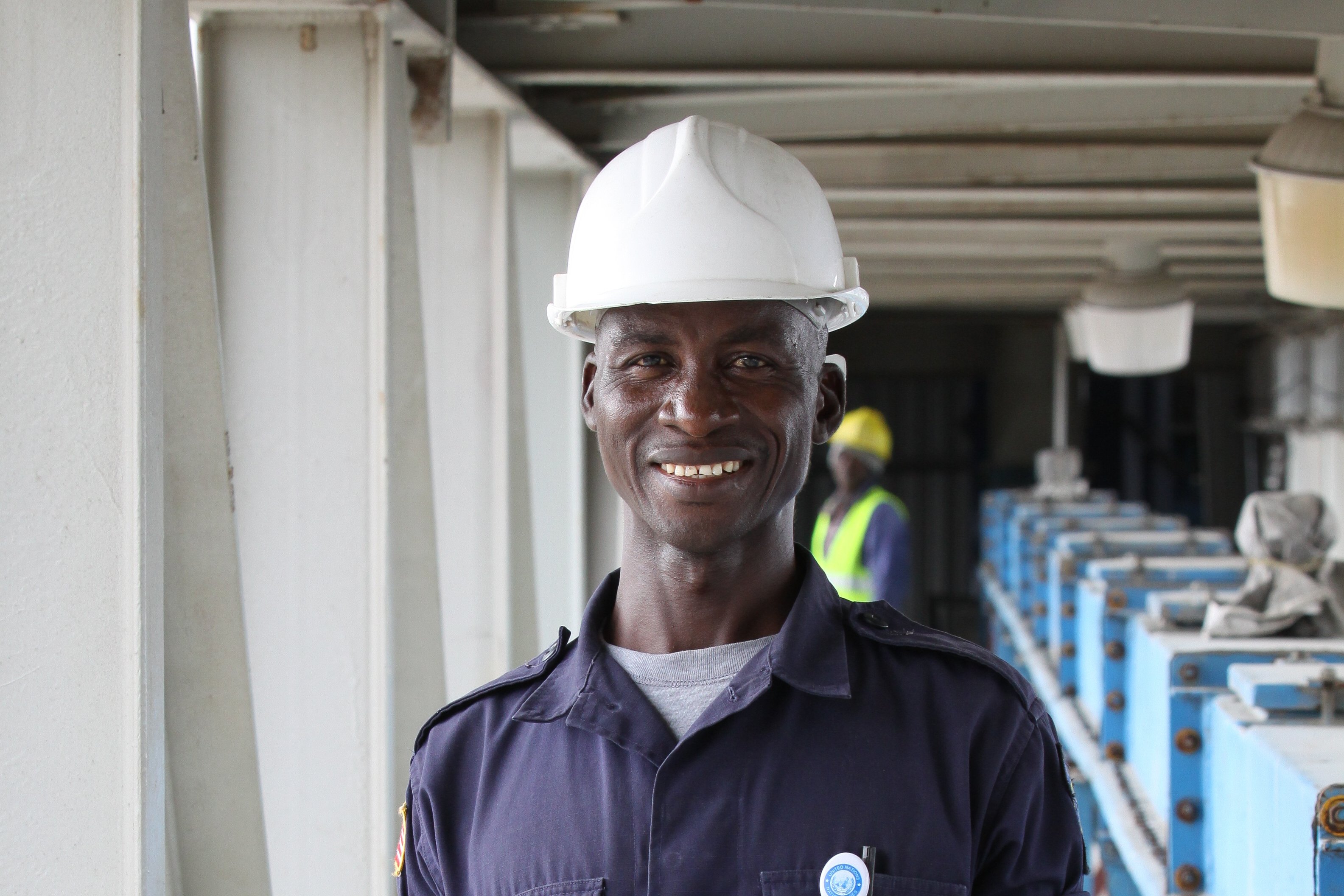 Employee from Africa with a white helmet
