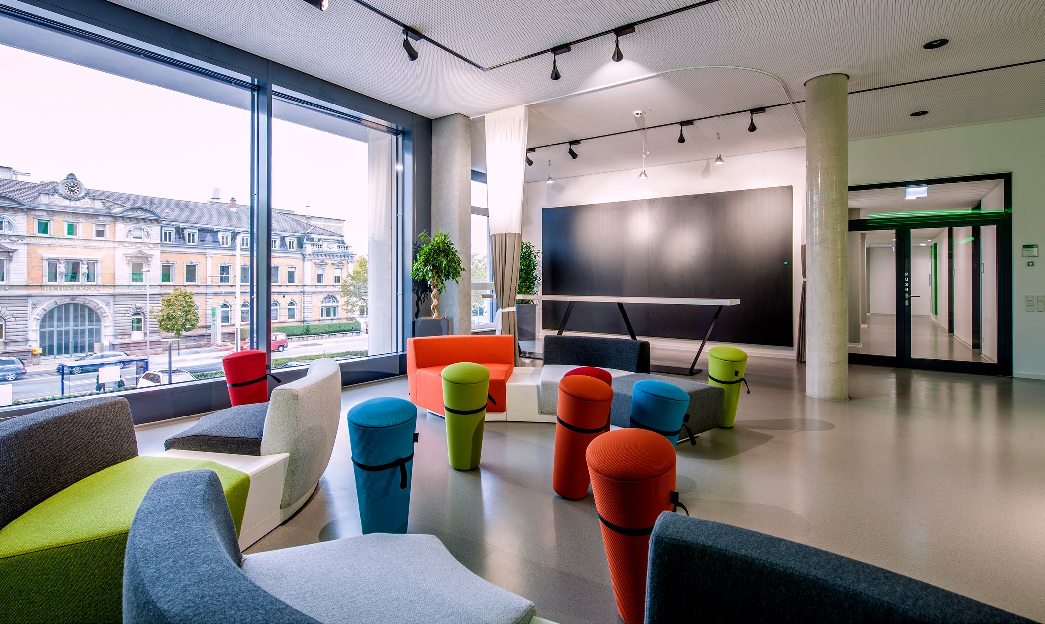 An open office space with colourful furniture