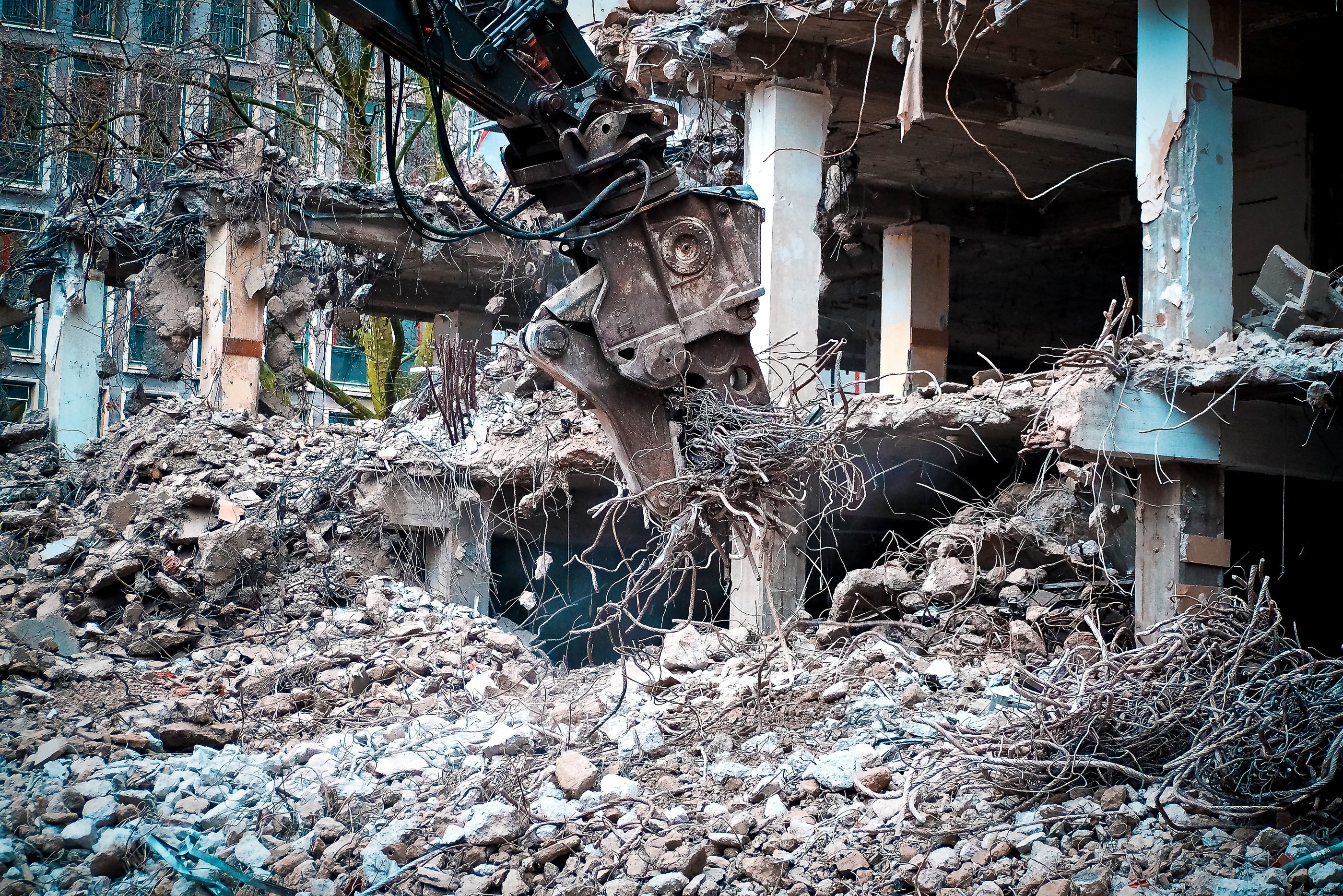 Building currently being demolished with heavy equipment