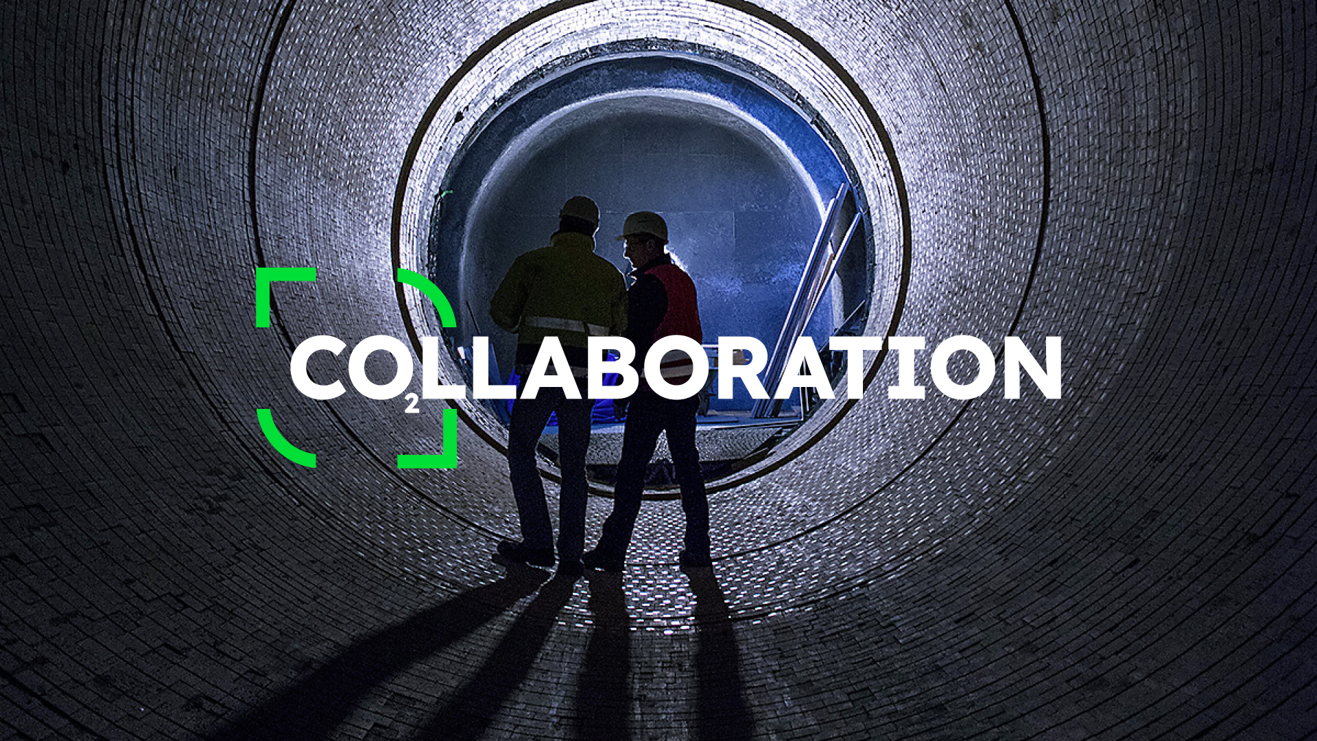 Two men are talking in a cement kiln, with the word "Collaboration" above them, in which the letters CO are represented as CO2.