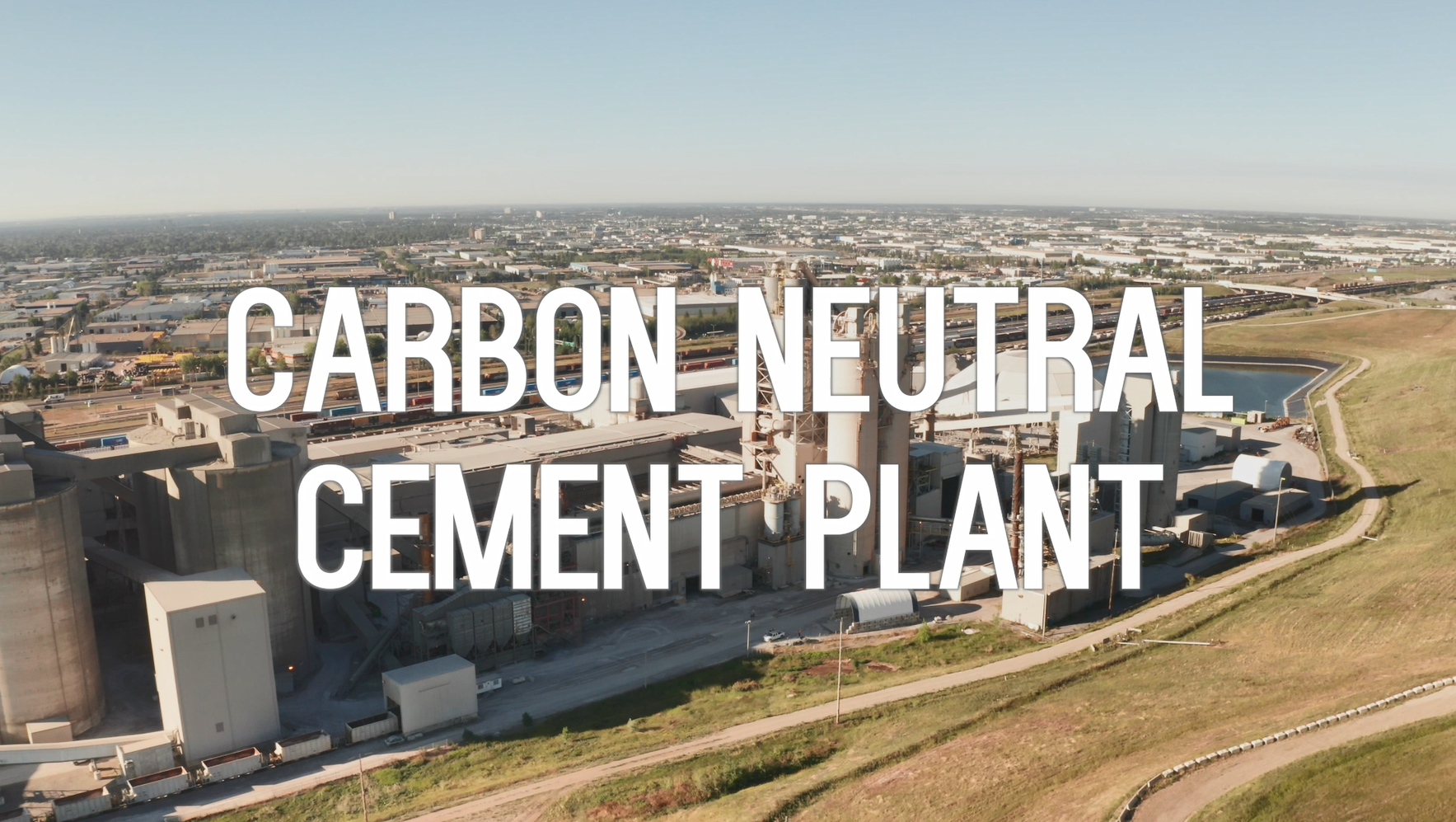 Aerial view of a cement plant, text overlay: carbon neutral cement plant