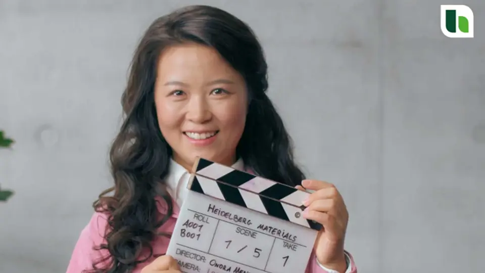 Employee from the image video for our employer brand with a film clapper