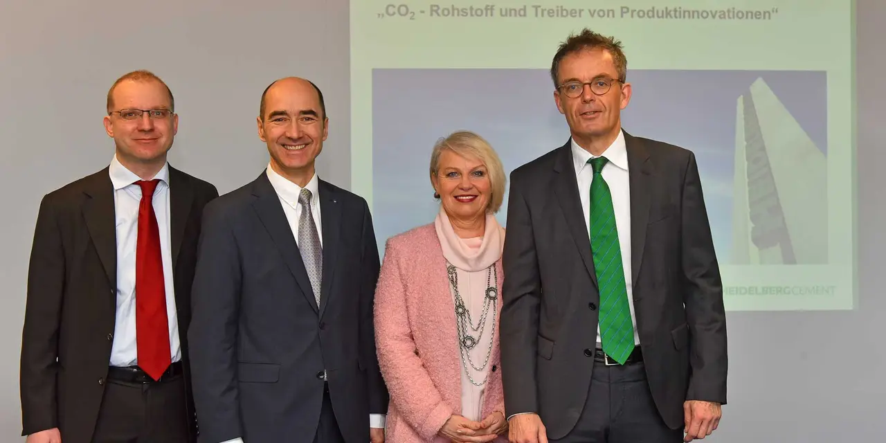 Four professionals standing before a presentation screen welcoming attendees to a CSR Breakfast event focused on CO₂ as an innovation driver.