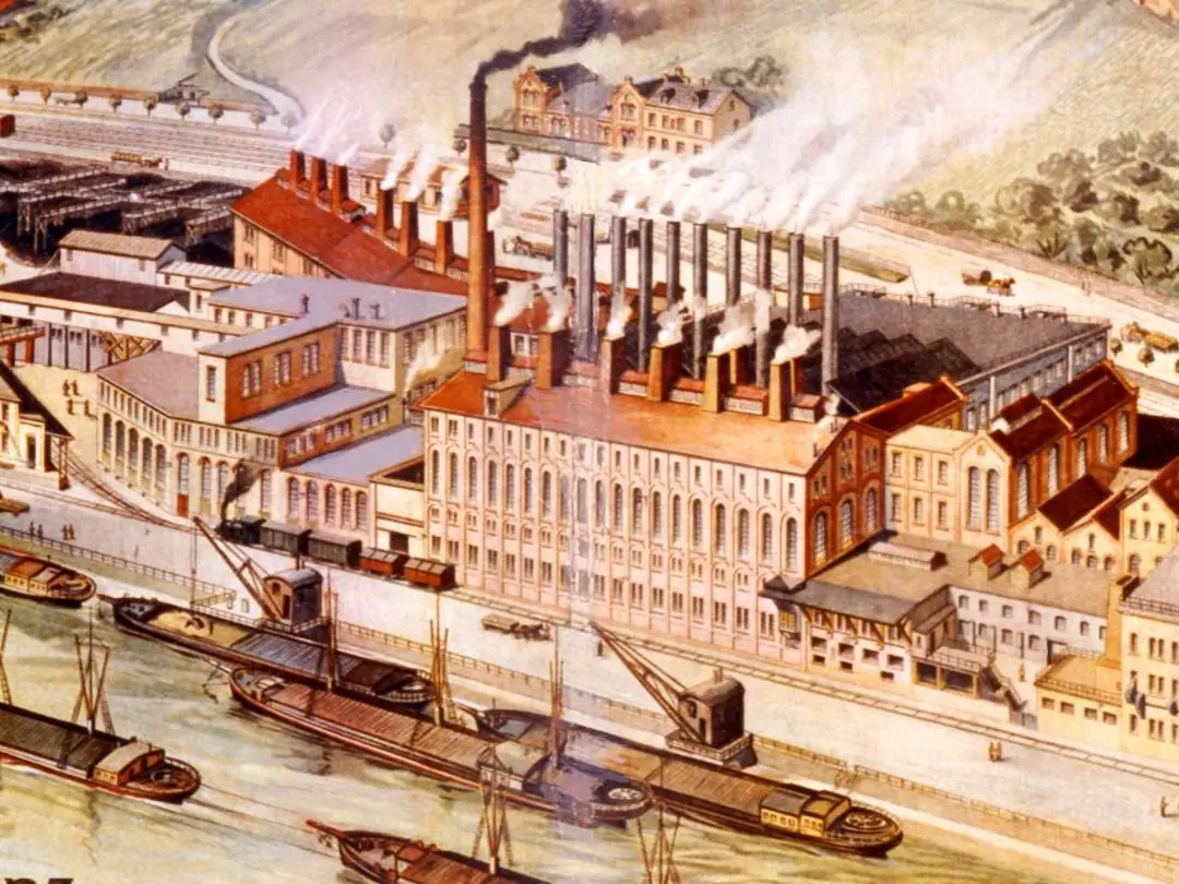 Factory building with smoking chimneys on a river