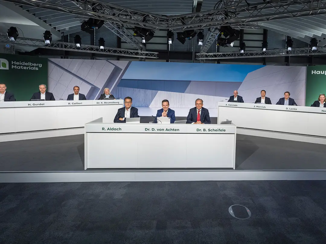 Board seated at a large, modern conference table during Heidelberg Materials' annual general meeting.