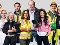 A diverse group of 12 professionals standing together, representing different industries. Some wear safety gear like hard hats and high-visibility vests, while others hold tablets or wear lab coats, symbolizing roles in construction, science, and business. They are positioned in a slight arc, smiling and facing forward against a neutral background.