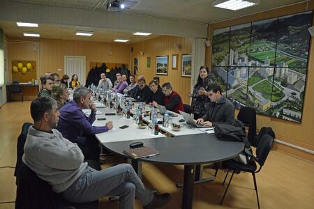 Group of people sitting around a conference table