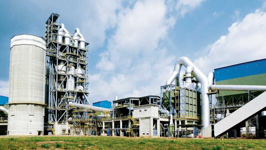 A clinker plant in Togo against a cloudy sky