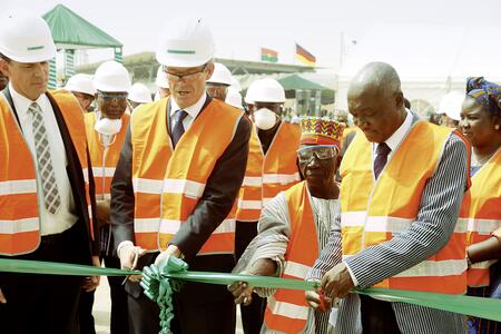 Ribbon cutting ceremony cement plant Cimburkina: Mr. Eric Goulignac, GM Cimburkina; Dr. Bernd Scheifele, CEO HeidelbergCement, local representative of the Emperor of the Mossi people; Mr. Hyppolite Dah, Minister of Industry and Commerce (from left to right)