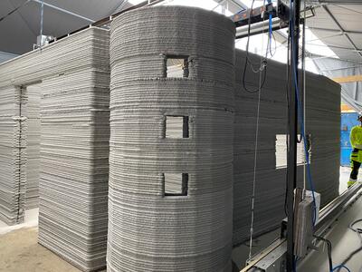3D-printed building with curved facade